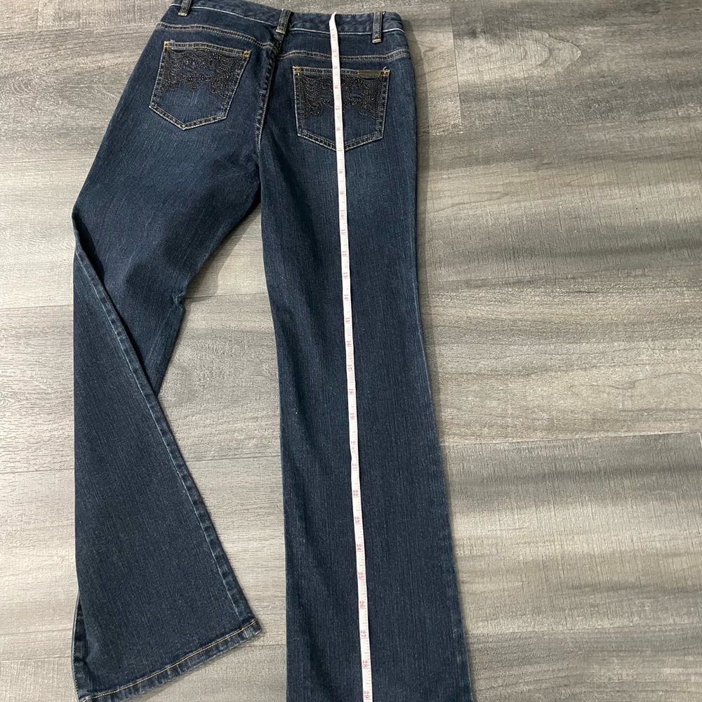 Kors embellished boot cut, dark denim jeans. Great condition. Size 6.
